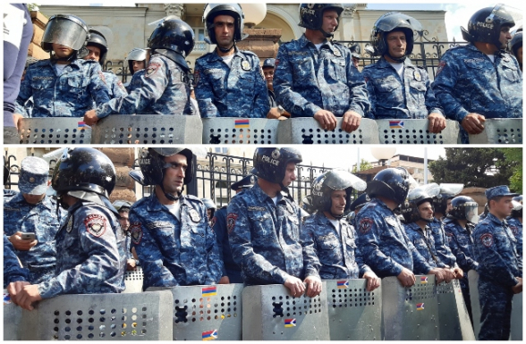 Полицейские с щитами, на которых флаги Арцаха